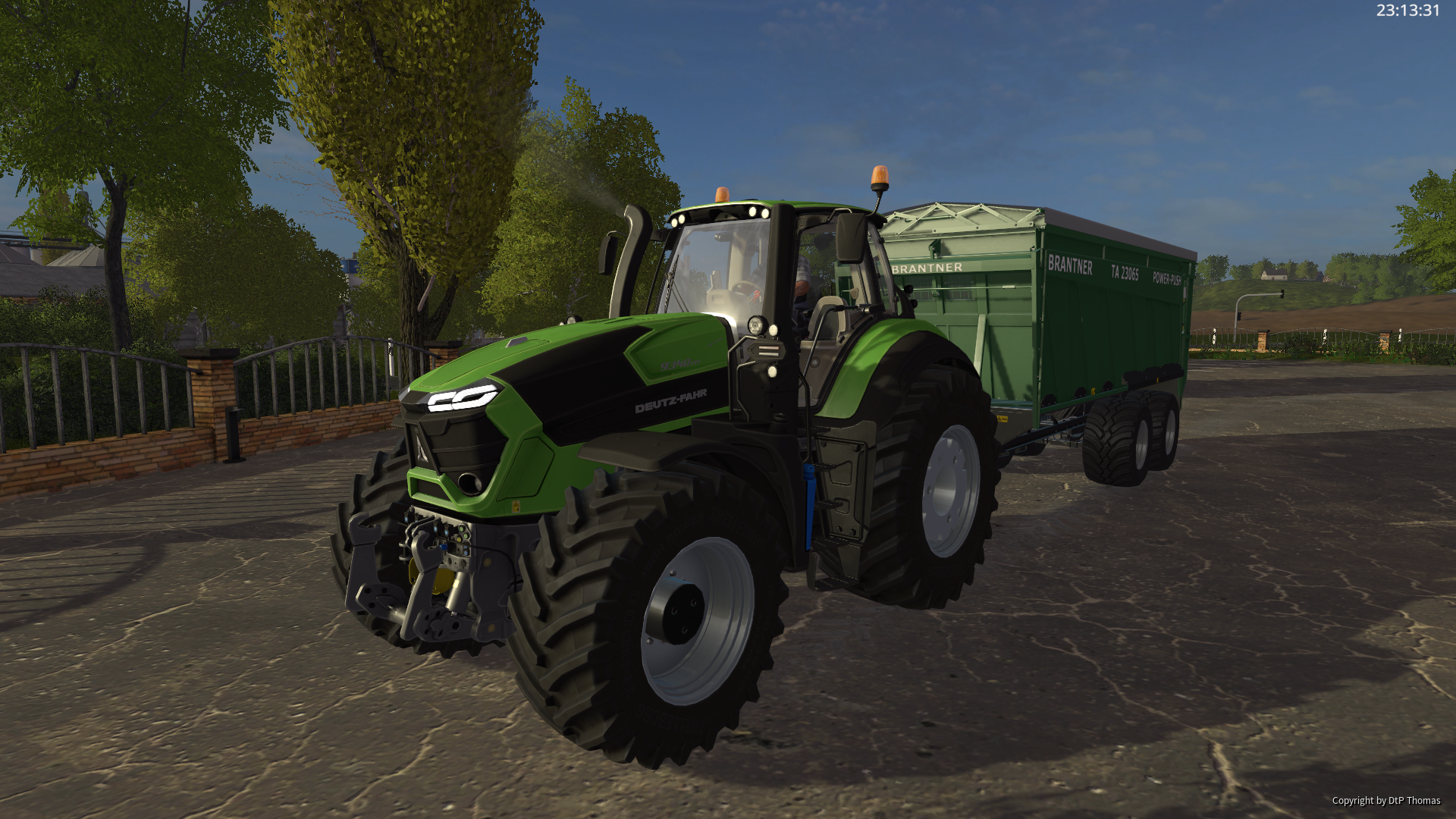 Deutz Fahr 9340 mit einem Brantner Power Anhänger