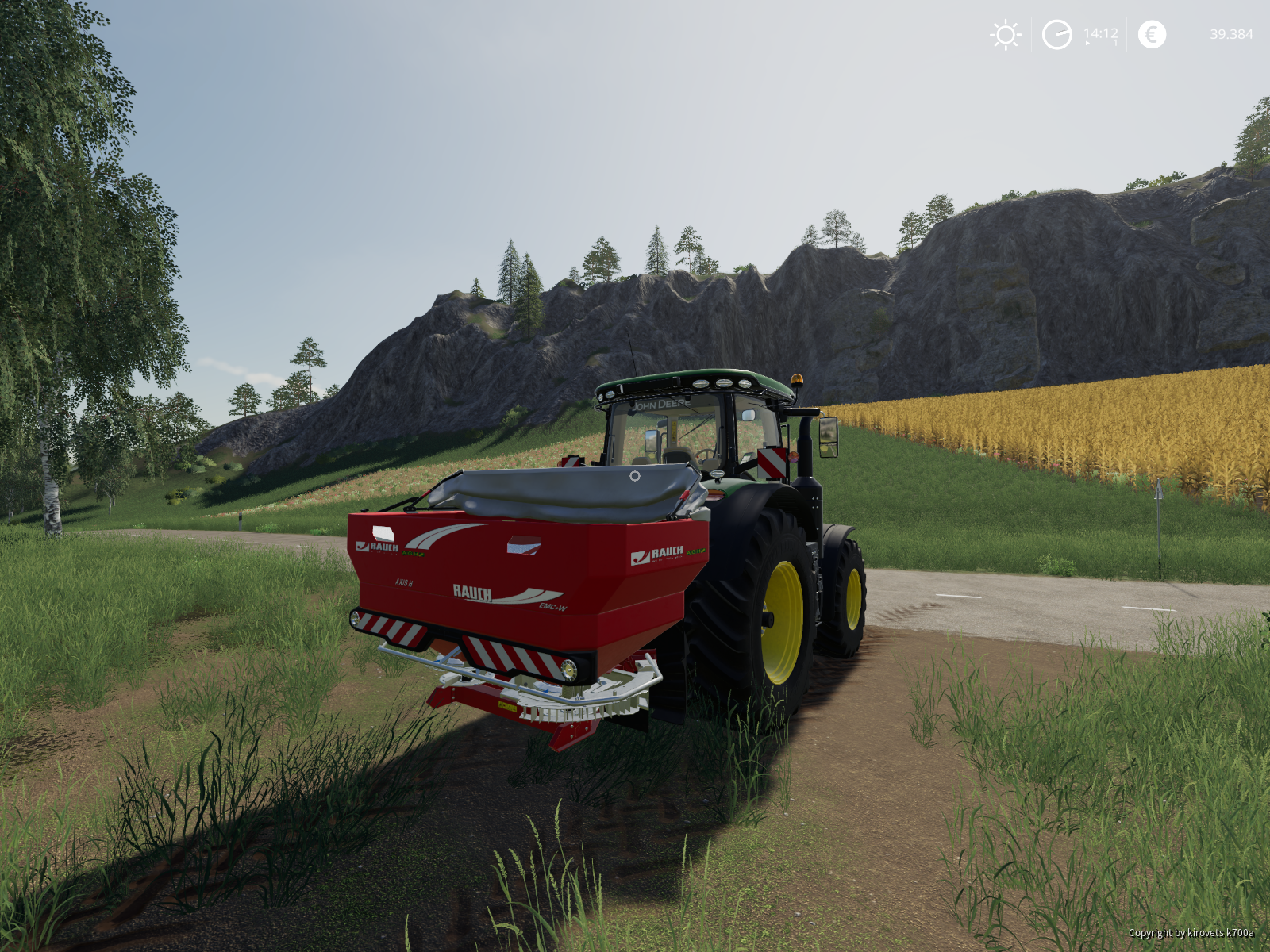John Deere 7310R mit Rauchstreuer