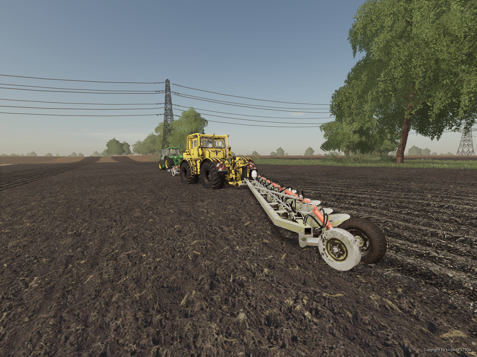 John Deere 8210 und Kirovets K700A am Pflügen