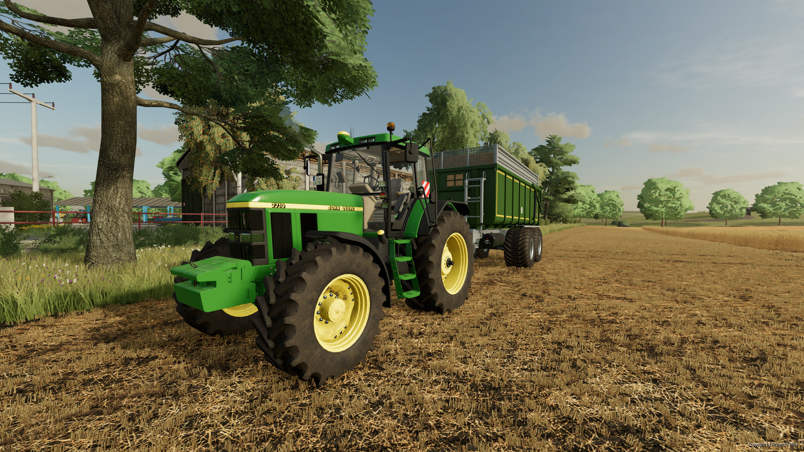 mit dem John Deere7710 dick am Weizen fahren